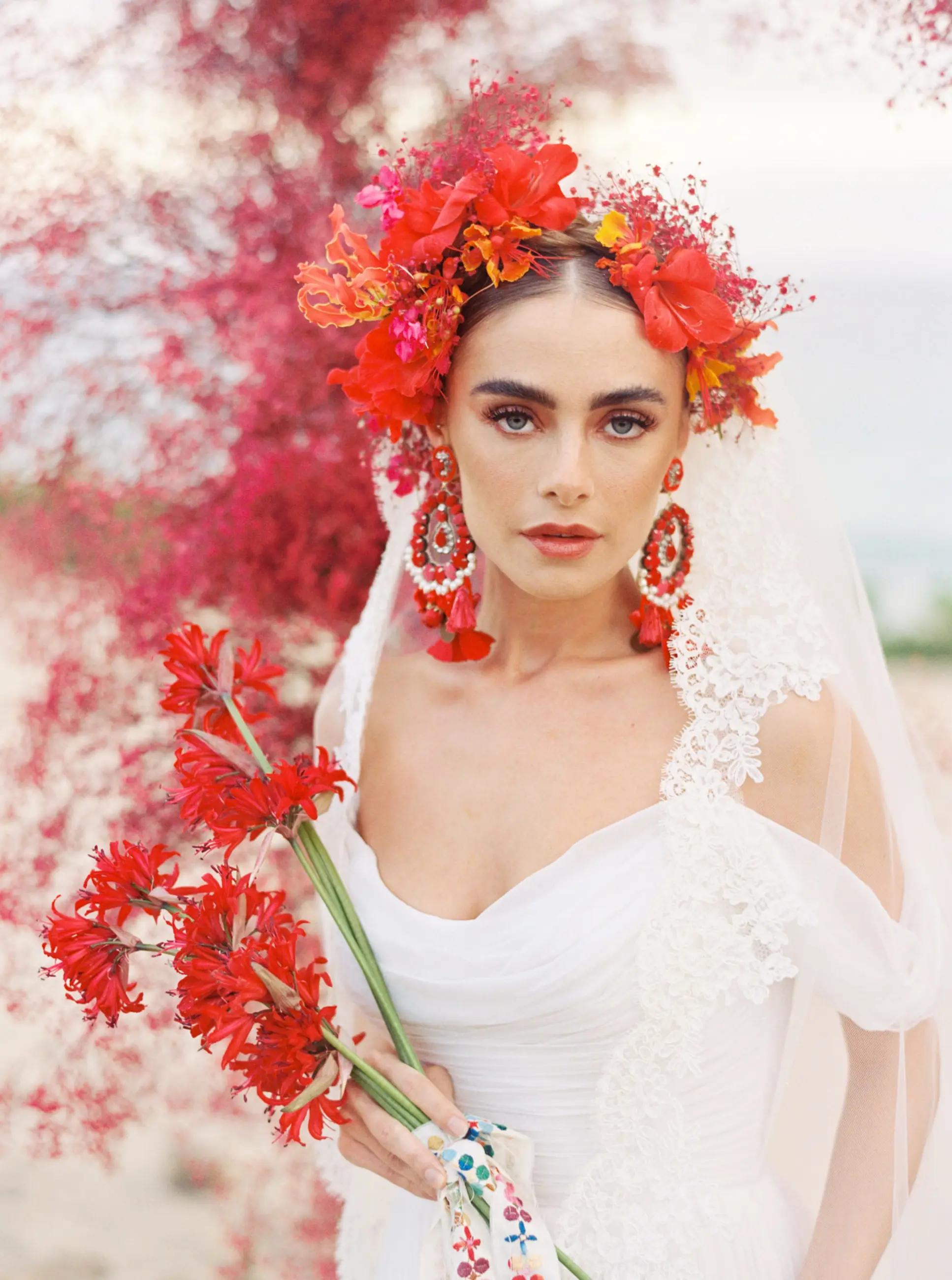Model wearing red floral hair jewellery.